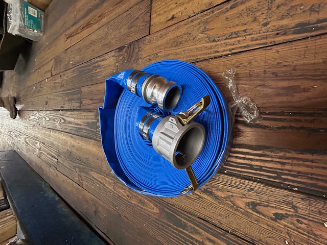 Blue layflat discharge hose with camlock fittings